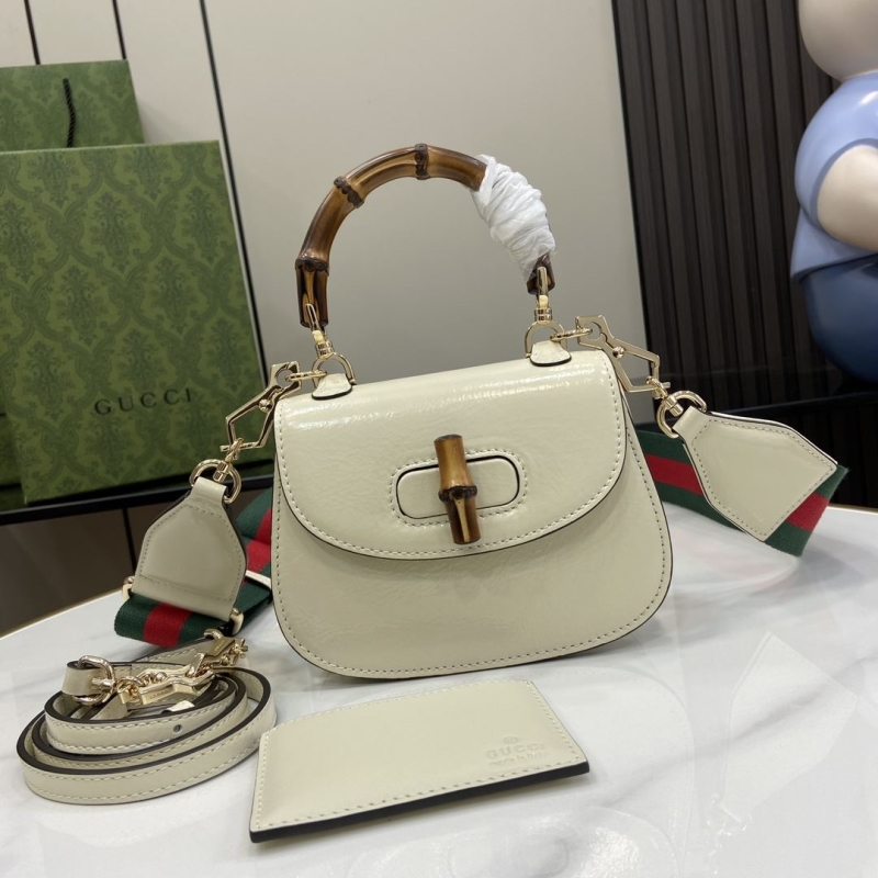 G*u*i top handle bags